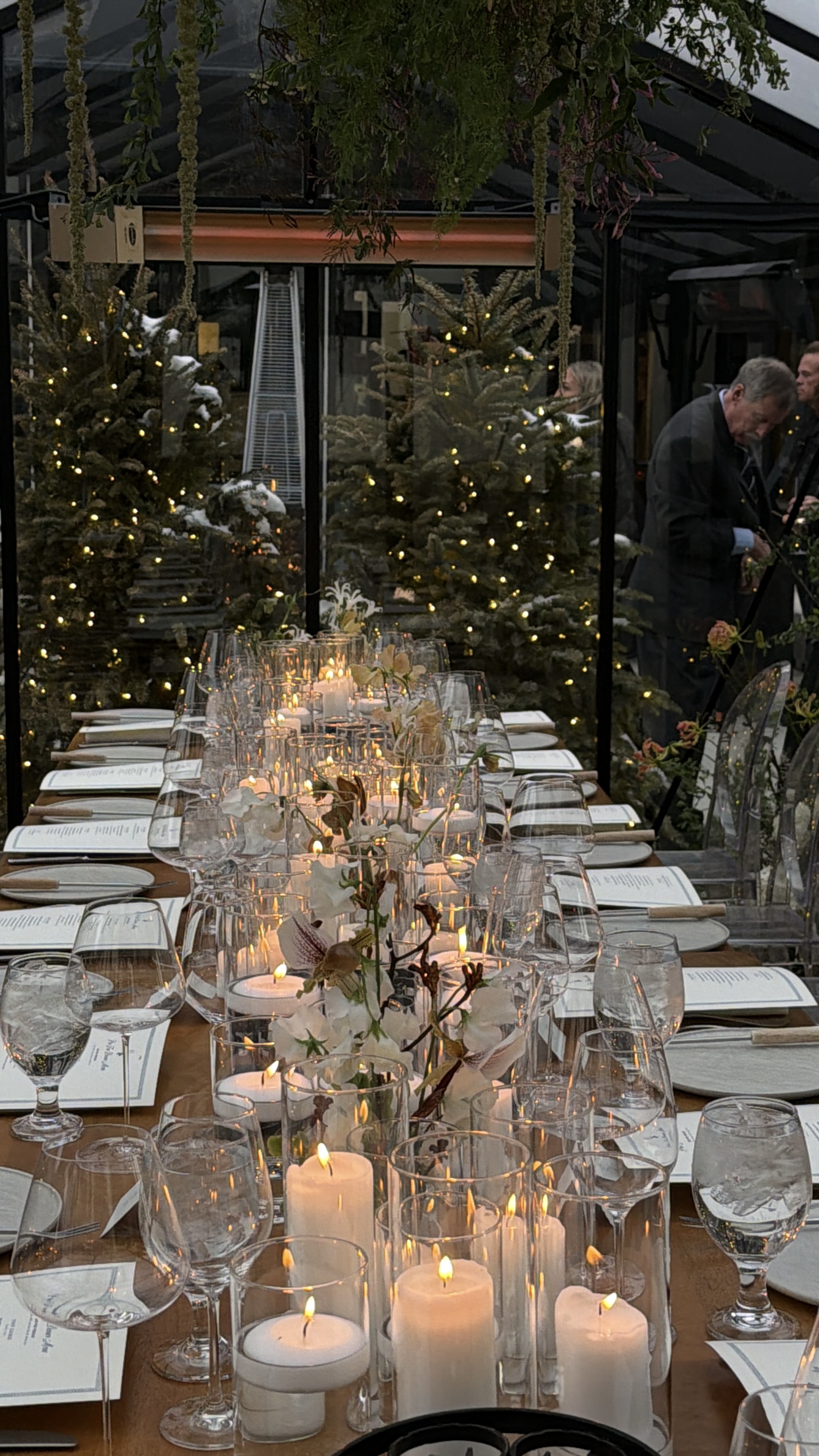 Candlelit dinner table with white florals